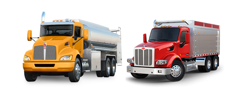 An orange Kenworth vocational truck next to a red Peterbilt vocational truck. An orange Kenworth vocational truck next to a red Peterbilt vocational truck.