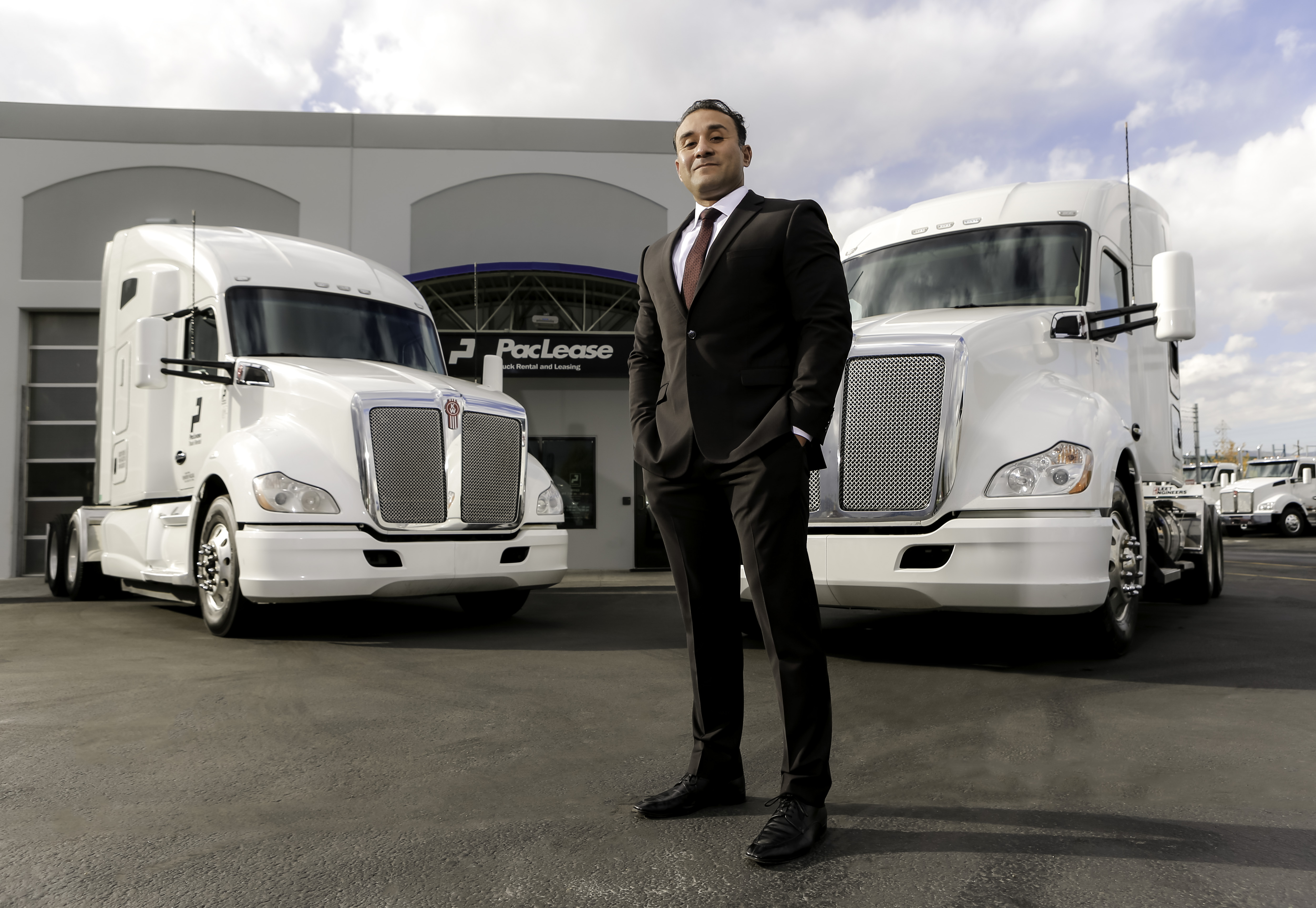 PacLease rental director, Chachi Hernandez,  with Kenworth T680 rental trucks at Kenworth Sales Company in Salt Lake City, UT